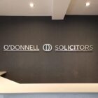 Solicitor signage acrylic stand off lettering faced off with brushed Ali look vinyl